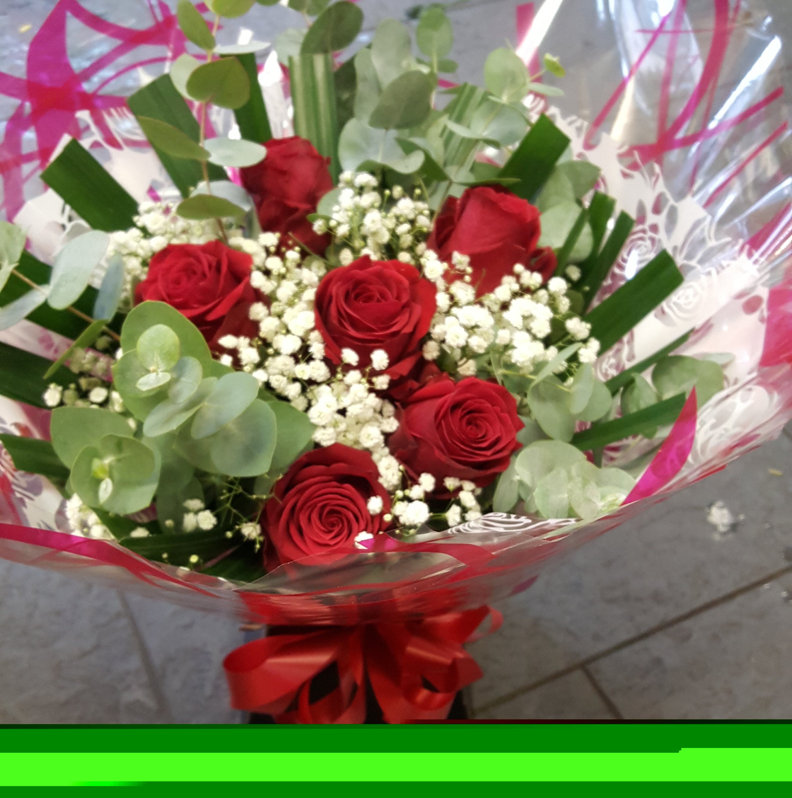 Eileen Jenkins Six red rose,gypsophilia and foliage aqua bouquet