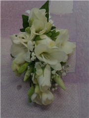 freesia and rose corsage