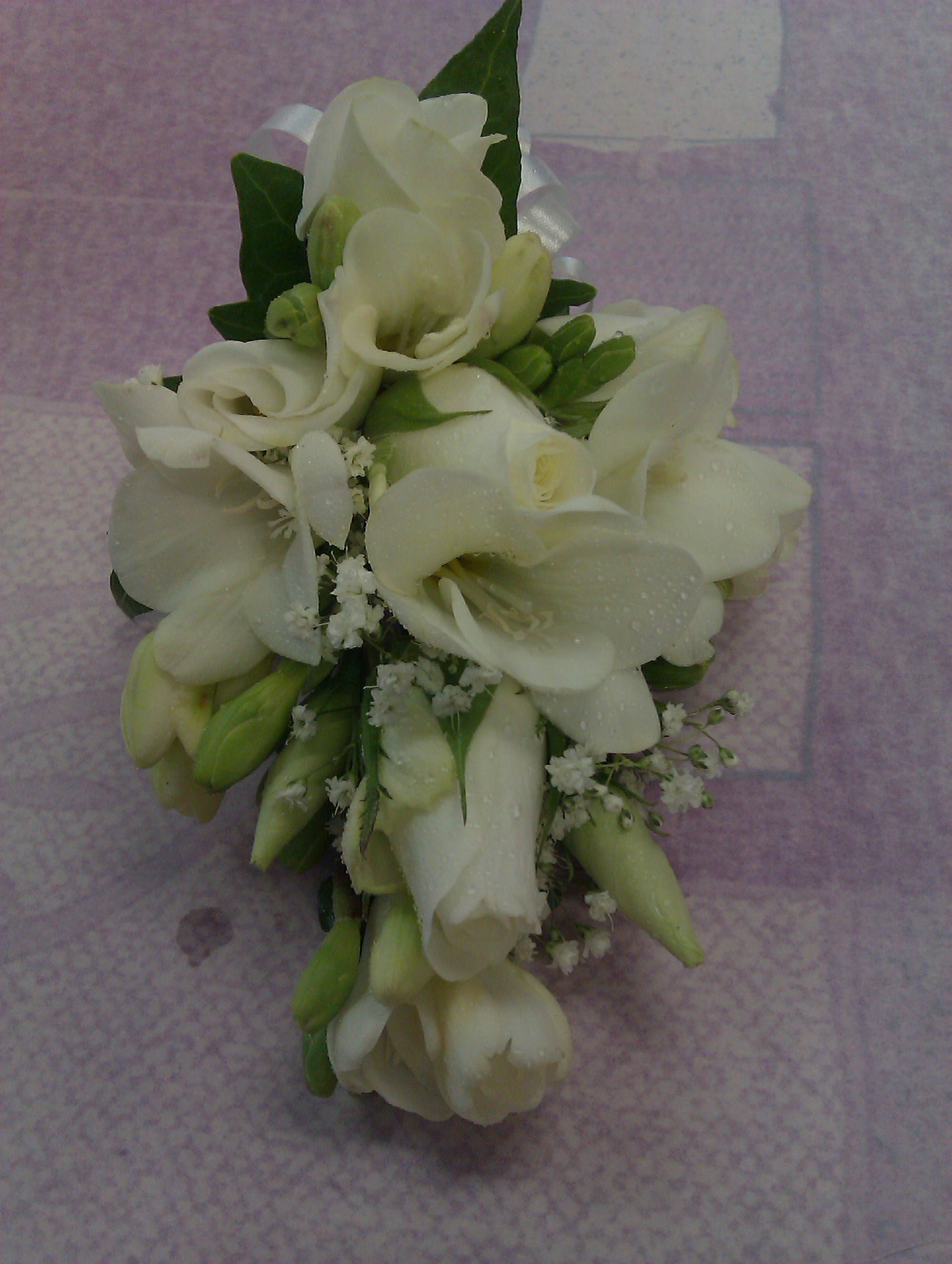 Eileen Jenkins freesia and rose corsage